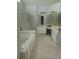 Bathroom with double sinks, shower, and bathtub at 533 Riverbirch Trce, Stone Mountain, GA 30087