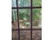 View of deck from window, surrounded by trees at 533 Riverbirch Trce, Stone Mountain, GA 30087