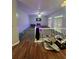 Spacious living room with a cozy fireplace and large windows at 533 Riverbirch Trce, Stone Mountain, GA 30087