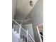 Elegant staircase with white railings and gray walls at 533 Riverbirch Trce, Stone Mountain, GA 30087
