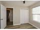 Bedroom with double door closet and access to hallway at 2184 Asquith Sw Ave, Marietta, GA 30008