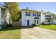 Two-story house with blue door and bay window at 2184 Asquith Sw Ave, Marietta, GA 30008