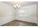 Dining room with wainscoting and chandelier at 4815 Plainsman Cir, Cumming, GA 30028