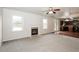 Open living room with kitchen view and fireplace at 4815 Plainsman Cir, Cumming, GA 30028