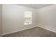 Bright bedroom featuring a window and neutral walls at 4815 Plainsman Cir, Cumming, GA 30028