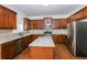 Kitchen with granite countertop island and stainless appliances at 4815 Plainsman Cir, Cumming, GA 30028