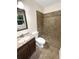 Clean bathroom with a tiled shower and vanity at 2390 Sandgate Rd, Atlanta, GA 30349