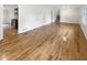 Hardwood floors in bright living room, open to kitchen at 2390 Sandgate Rd, Atlanta, GA 30349