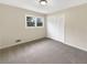 Spacious bedroom with neutral walls, carpeting, and built-in closet at 2390 Sandgate Rd, Atlanta, GA 30349