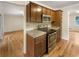 Kitchen with stainless steel appliances and wood cabinets at 2390 Sandgate Rd, Atlanta, GA 30349