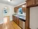 Updated kitchen with wood cabinets, granite counters, and stainless steel appliances at 2390 Sandgate Rd, Atlanta, GA 30349
