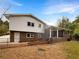 Brick house with a covered patio and fenced backyard at 2390 Sandgate Rd, Atlanta, GA 30349