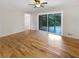 Spacious living area featuring hardwood floors and access to a patio at 2390 Sandgate Rd, Atlanta, GA 30349