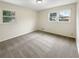 Bright bedroom featuring neutral walls and new carpeting at 2390 Sandgate Rd, Atlanta, GA 30349