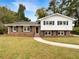 Brick ranch house with a landscaped yard and walkway at 2390 Sandgate Rd, Atlanta, GA 30349