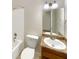 Clean bathroom with a bathtub, toilet, sink, and granite countertop at 2390 Sandgate Rd, Atlanta, GA 30349