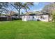 Large backyard with grassy lawn and mature trees at 1246 Lyle Ave, East Point, GA 30344