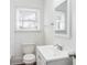Clean bathroom with white vanity, single sink, and subway tile at 1246 Lyle Ave, East Point, GA 30344