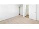 Large bedroom with neutral carpeting and access to bathroom at 1246 Lyle Ave, East Point, GA 30344