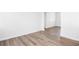 Spacious bedroom with new wood-look flooring and fresh paint at 1246 Lyle Ave, East Point, GA 30344