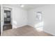 Bedroom with neutral carpeting and access to the kitchen and hallway bathroom at 1246 Lyle Ave, East Point, GA 30344