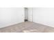 Spacious bedroom with neutral carpeting and two closets at 1246 Lyle Ave, East Point, GA 30344