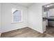 Cozy dining area with wood-look flooring and view into kitchen at 1246 Lyle Ave, East Point, GA 30344