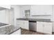 Modern kitchen with white cabinets, granite countertops, and stainless steel appliances at 1246 Lyle Ave, East Point, GA 30344