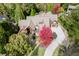 Luxury home with circular driveway and vibrant tree at 879 Big Horn Hollow, Suwanee, GA 30024