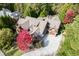 Large home with driveway and surrounding trees at 879 Big Horn Hollow, Suwanee, GA 30024