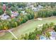 Aerial view of luxury homes and golf course at 879 Big Horn Hollow, Suwanee, GA 30024