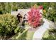 Luxury home with circular driveway and vibrant tree at 879 Big Horn Hollow, Suwanee, GA 30024