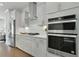 Modern kitchen with stainless steel appliances and white cabinetry at 1086 Battery Park Rd, Decatur, GA 30033