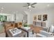 Living room featuring hardwood floors, modern decor, and an open kitchen at 1086 Battery Park Rd, Decatur, GA 30033