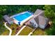 Community pool with surrounding lounge chairs, clubhouse, and landscaping at 1086 Battery Park Rd, Decatur, GA 30033