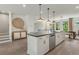 Modern kitchen with island, stainless steel appliances, and hardwood floors at 1090 Battery Park Rd, Decatur, GA 30033