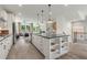 Open concept kitchen with large island, stainless steel appliances, and white cabinetry at 1090 Battery Park Rd, Decatur, GA 30033