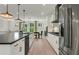 Modern kitchen with white cabinets, large island, and stainless steel appliances at 1090 Battery Park Rd, Decatur, GA 30033