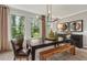Bright dining room featuring a large table and modern chandelier at 1090 Battery Park Rd, Decatur, GA 30033