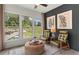 Sunroom with comfortable seating and large windows offering ample natural light at 1090 Battery Park Rd, Decatur, GA 30033