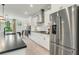 Modern kitchen with white cabinets, large island, and stainless steel appliances at 1090 Battery Park Rd, Decatur, GA 30033