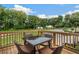 Relaxing deck overlooking wooded area with seating for four at 1090 Battery Park Rd, Decatur, GA 30033