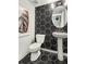 Stylish powder room with hexagon tile and pedestal sink at 1090 Battery Park Rd, Decatur, GA 30033