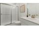 Clean bathroom with a walk-in shower and white tile at 1090 Battery Park Rd, Decatur, GA 30033