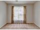 Bright bedroom with large window, neutral walls, and carpet flooring at 2580 Sandown Ct, Cumming, GA 30041