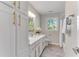 Modern bathroom with white cabinets and a bathtub at 4013 Chelsea Ln, Marietta, GA 30062