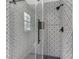 Updated shower with patterned tile and glass enclosure at 4013 Chelsea Ln, Marietta, GA 30062