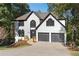 Stunning two-story home with white exterior and black accents at 4013 Chelsea Ln, Marietta, GA 30062
