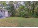 Large backyard with lush green grass and mature trees at 1784 Danrich Dr, Decatur, GA 30032