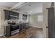 Modern kitchen with dark gray cabinets, granite countertops, and stainless steel appliances at 1784 Danrich Dr, Decatur, GA 30032